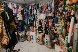 assorted clothes on white steel rack